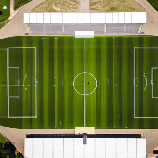 Tầm nhìn từ trên cao của một sân vận động bóng đá với cỏ được chăm sóc đẹp mắt
